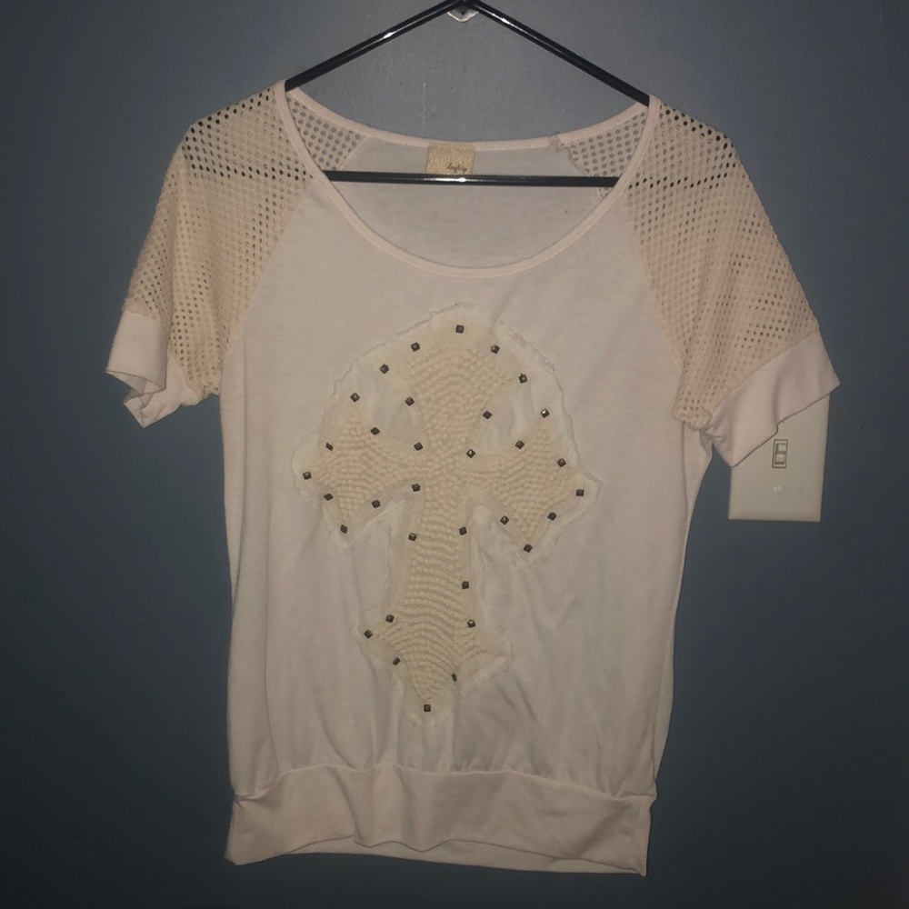 Cream color soft top with cross on front